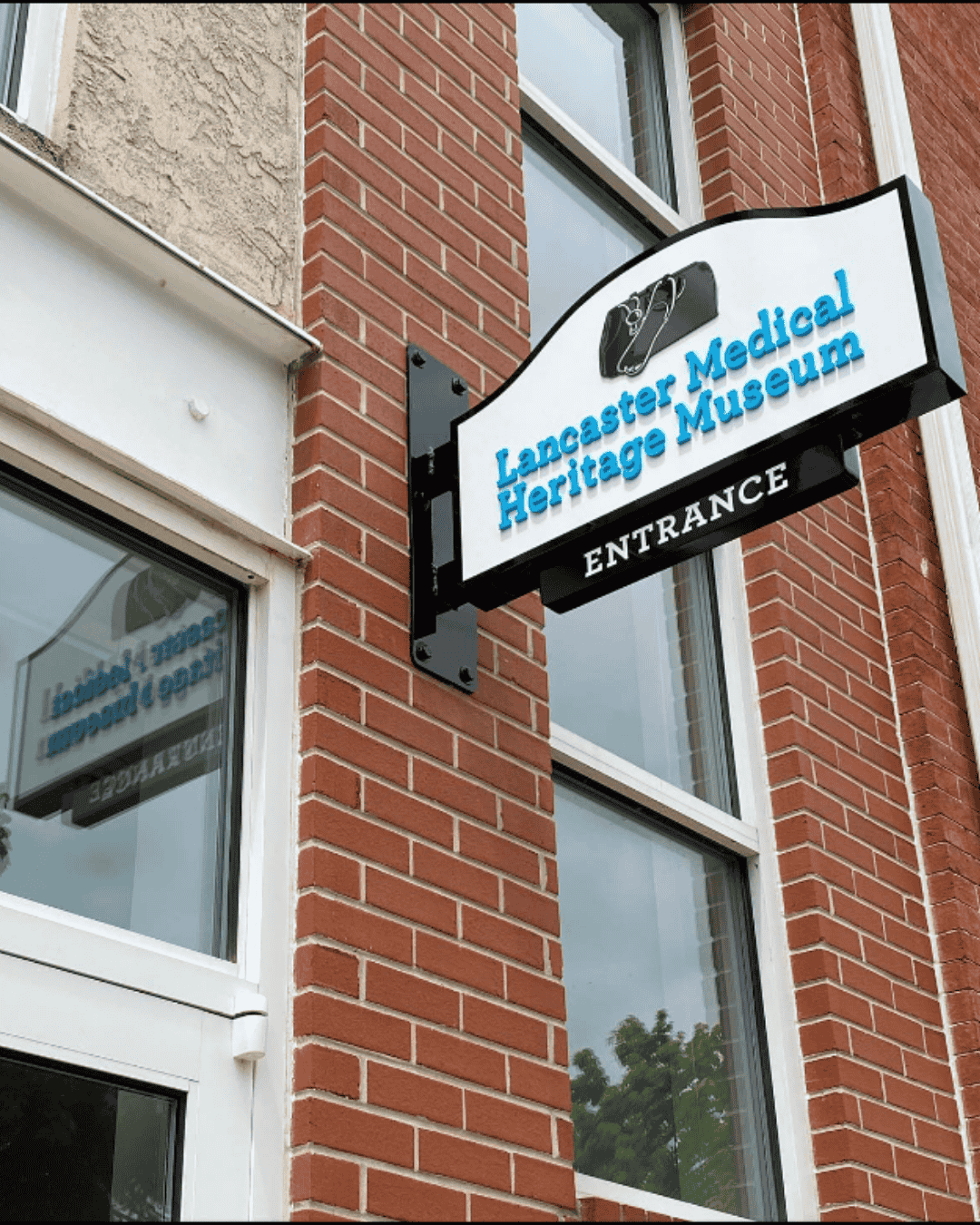 sign on side of brick building